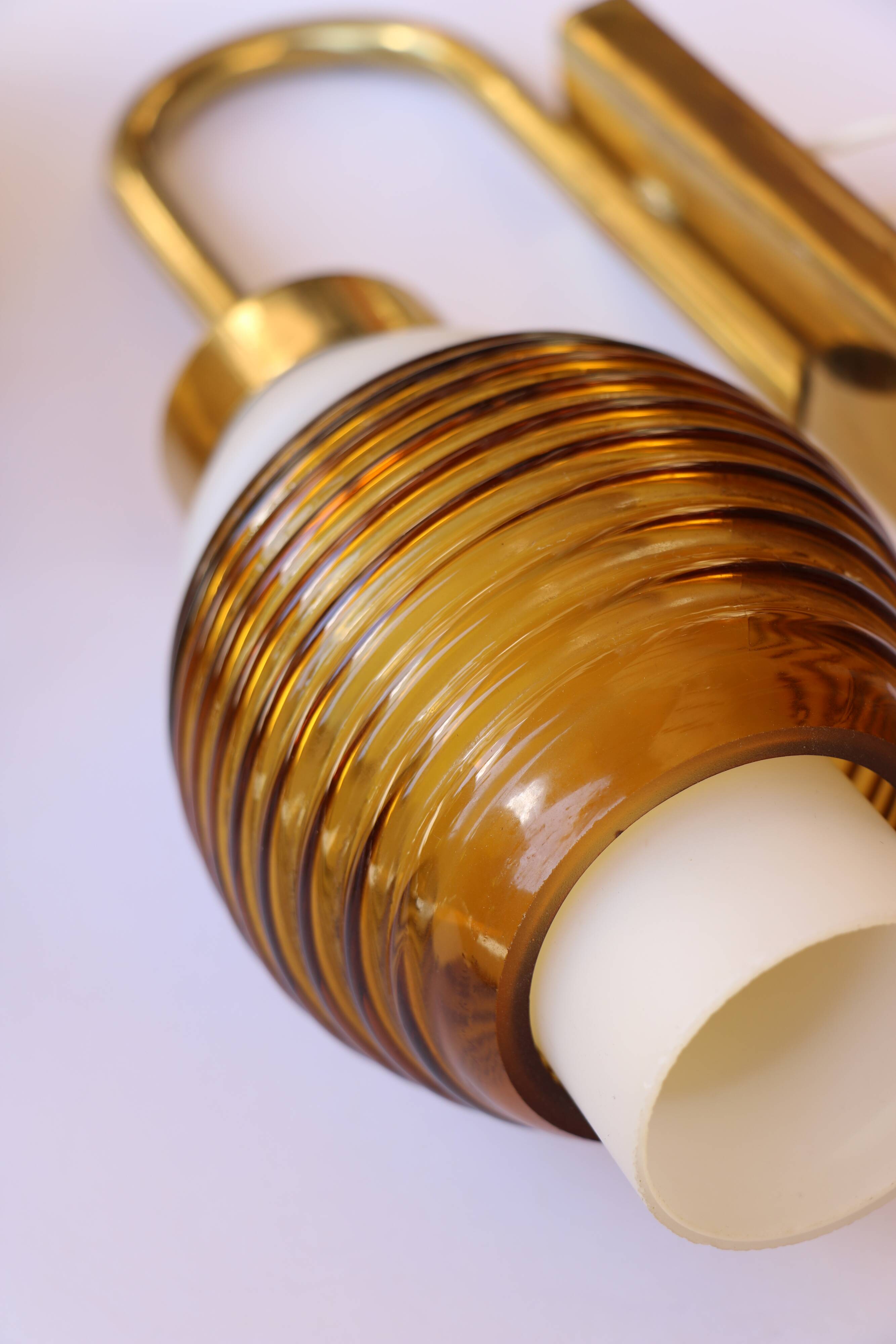 Pair of Scandinavian wall sconces, brass, opal glass and amber glass.