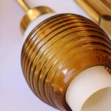 Pair of Scandinavian wall sconces, brass, opal glass and amber glass.