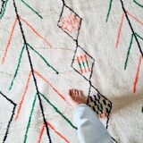 White wool Berber rug with fluorescent orange green patterns