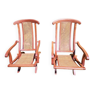 Pair of teak and canned deckchairs