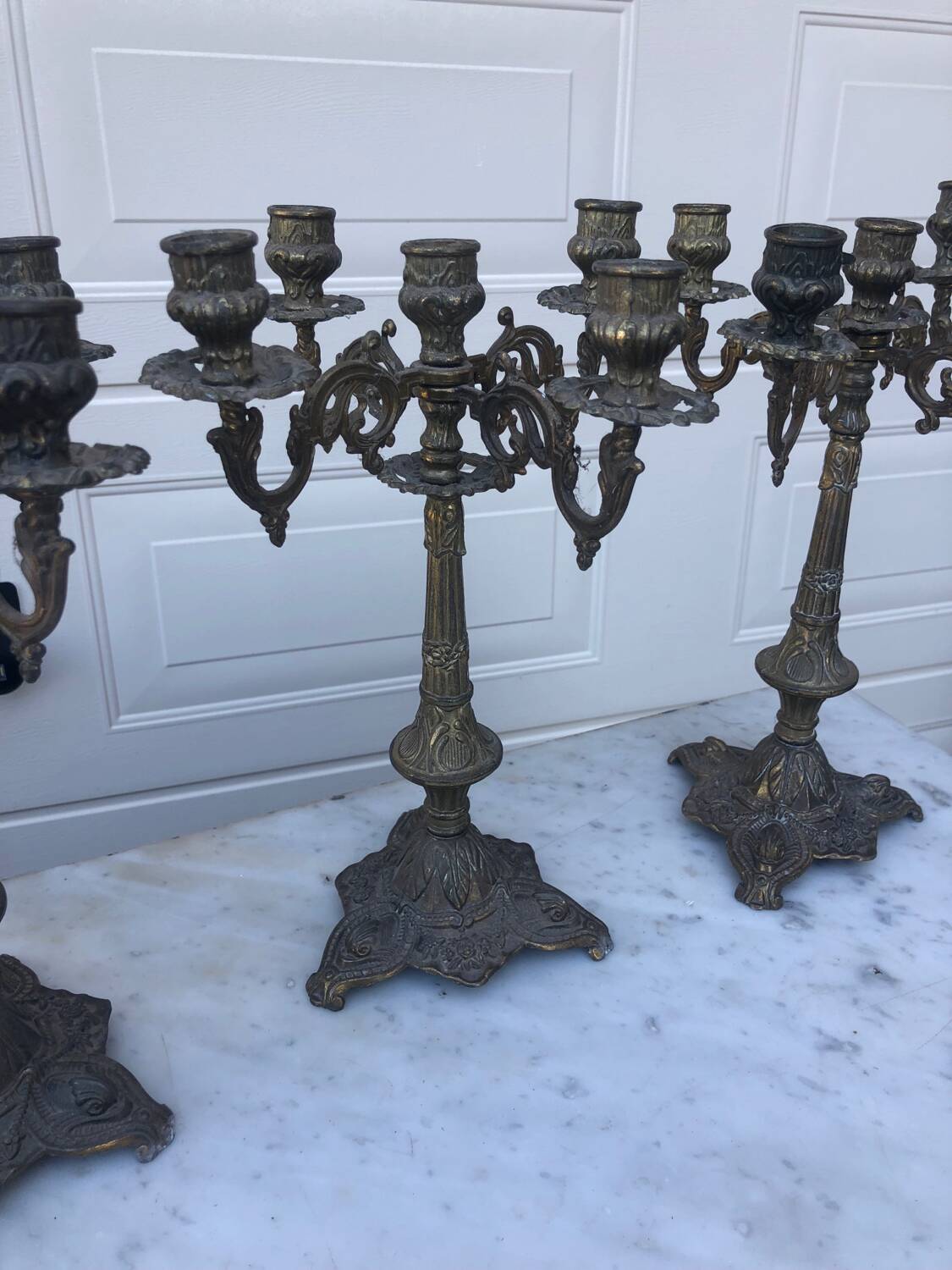 4 identical old brass candlesticks