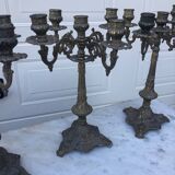 4 identical old brass candlesticks