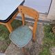 Vintage Scandinavian table and chair set with a wooden frame and formica top.