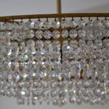 Old chandelier with tassels and brass