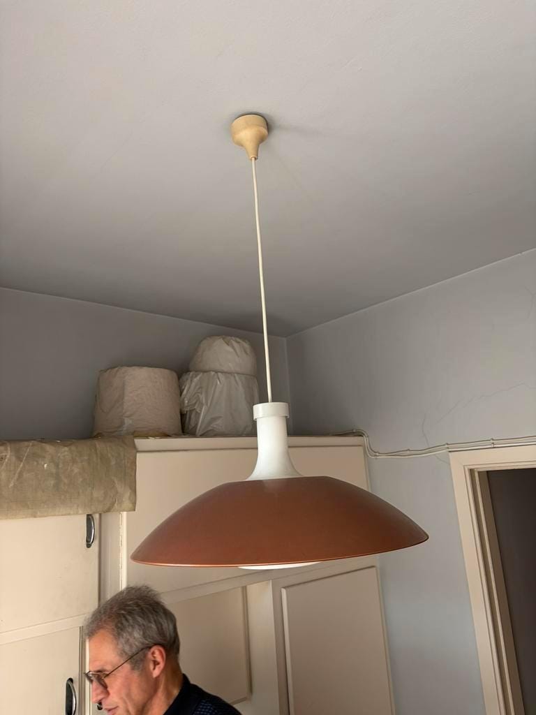 Vintage orange rust metal pendant light with opaline glass.