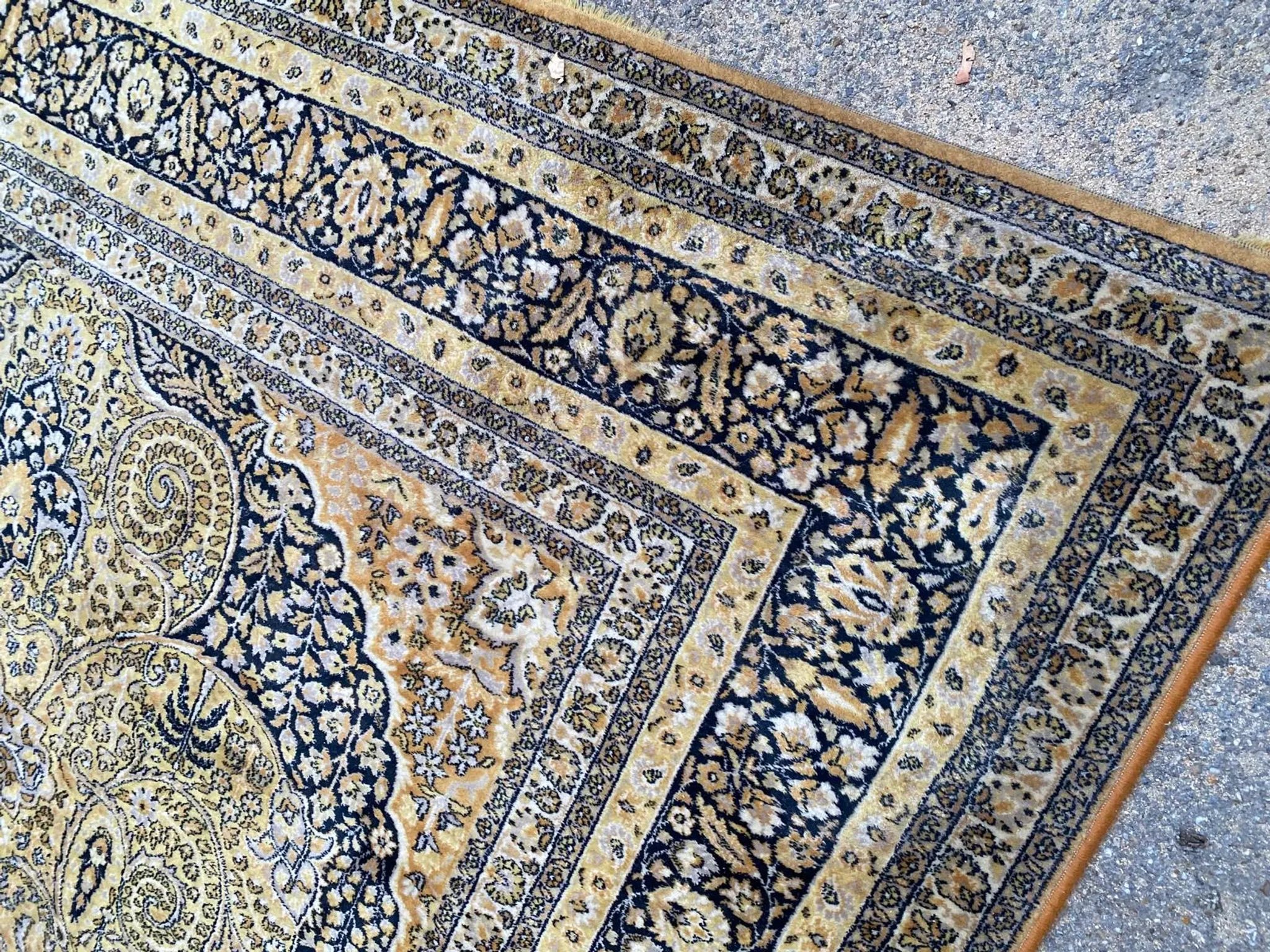 Large Persian wool rug 250x350 cm in gold and navy blue.