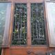 Oak entrance door and its frame and transom, wrought iron gates