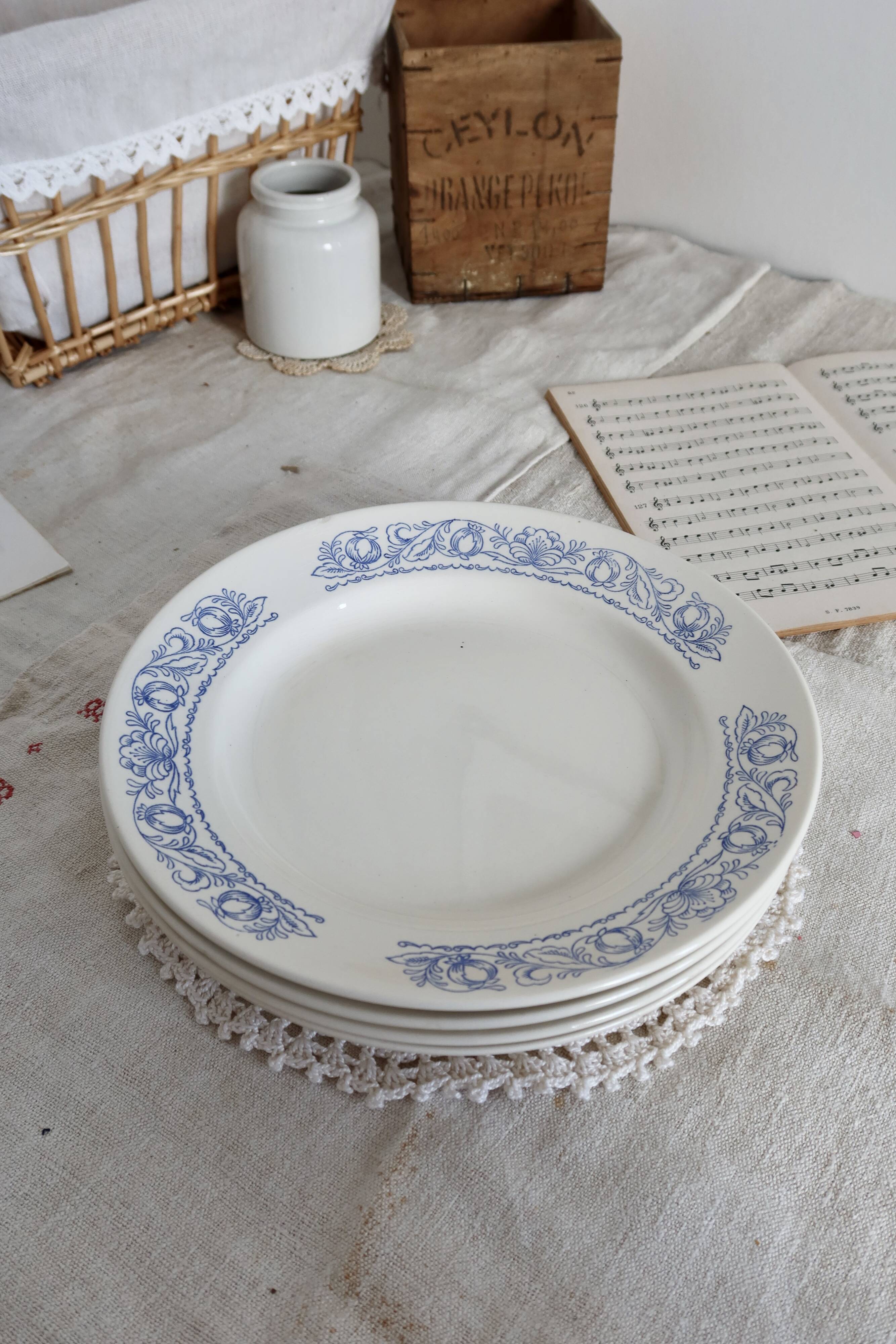 4 vintage white soup plates with blue border
