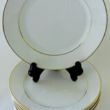 Suite of twelve table plates in white and gold porcelain.