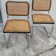 Pair of chairs by Marcel Breuer in black canework model B32 signed Italy