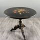 Napoleon III guéridon table in black lacquered wood with floral painted decoration, 19th century.