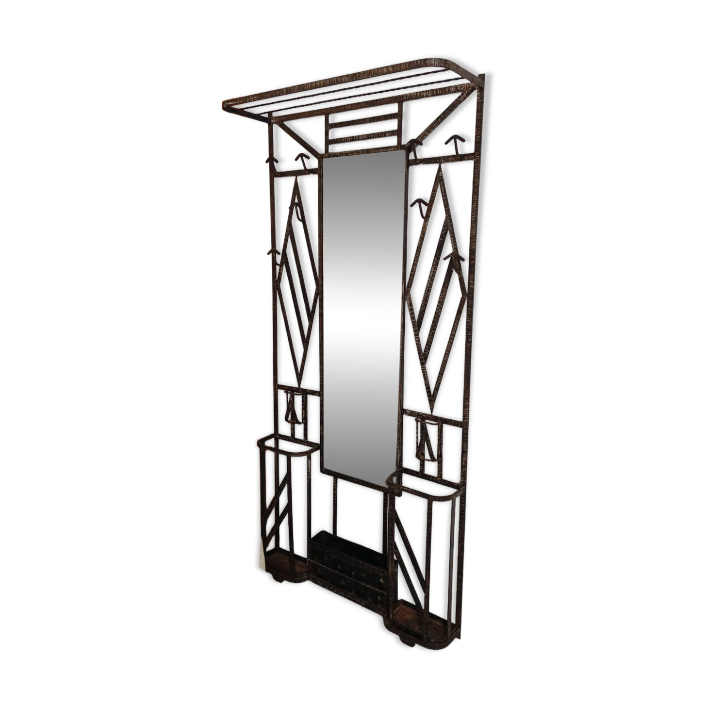 Exceptional and imposing hall wardrobe in hammered wrought iron.
