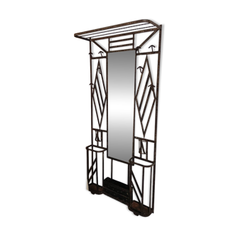 Exceptional and imposing hall wardrobe in hammered wrought iron.