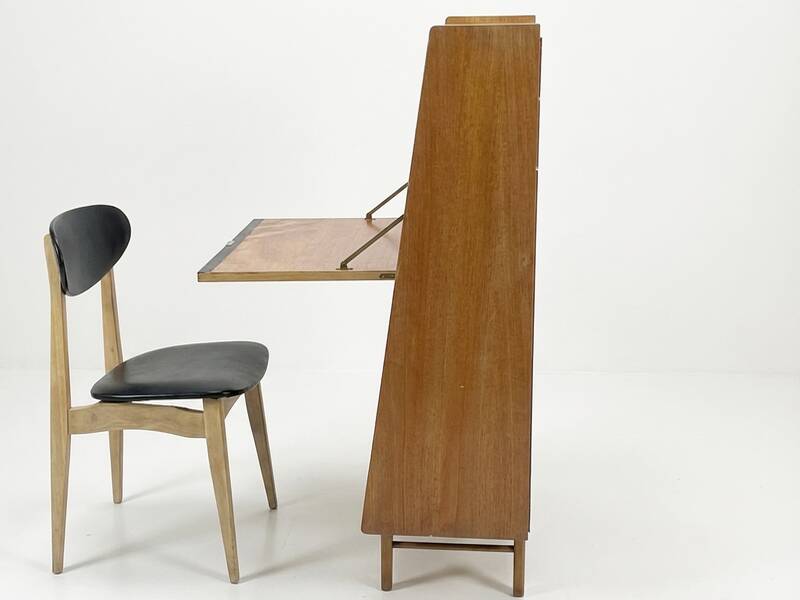 Vintage 1960s secretary desk with an angled design, light wood, and tapered legs.