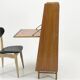 Vintage 1960s secretary desk with an angled design, light wood, and tapered legs.