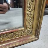 19th century gilt mirror with flowers and foliage decor