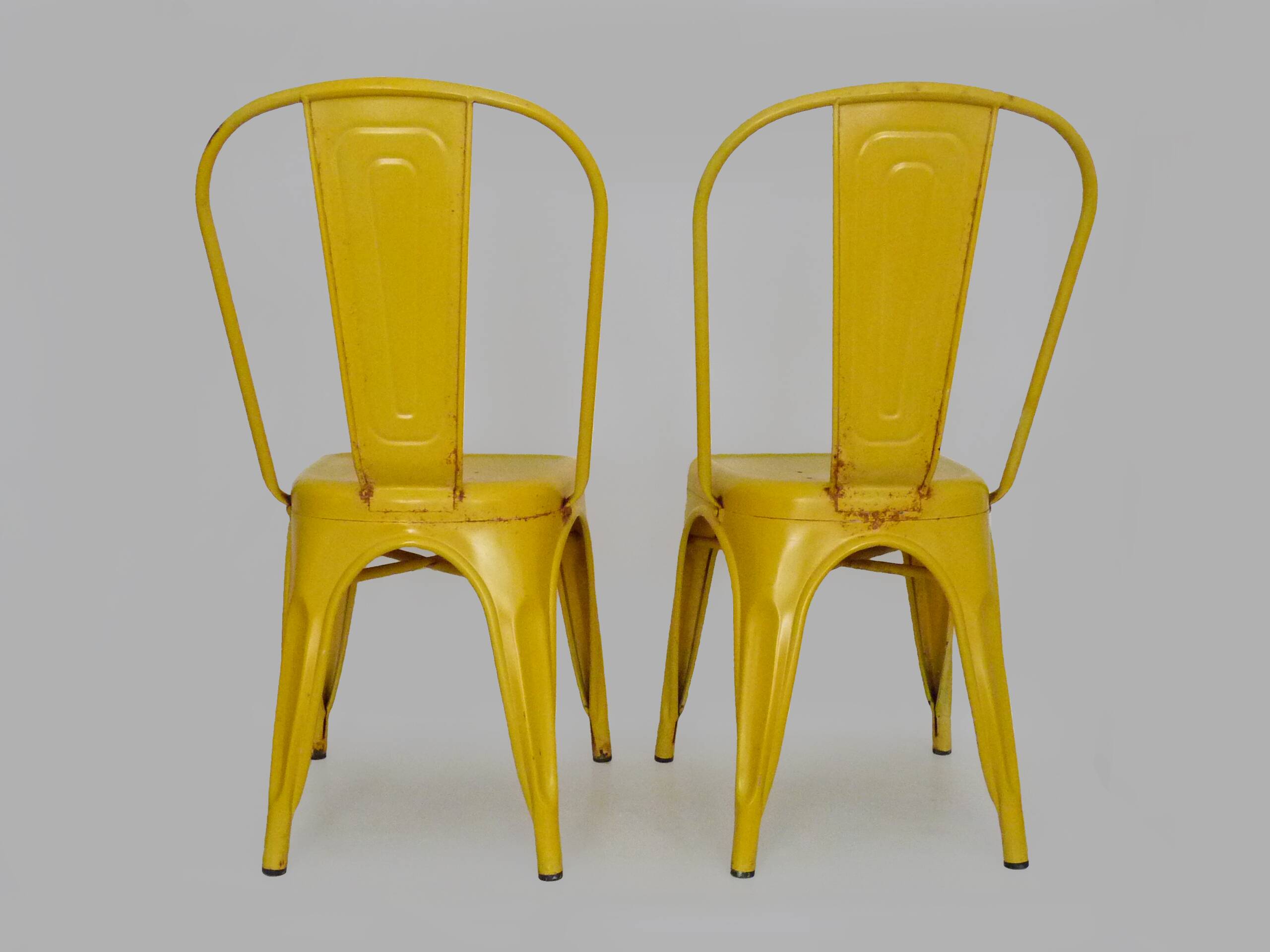 Pair of Tolix Chairs in yellow metal by Xavier Pauchard