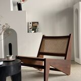 Reclined armchair in canned teak in natural wood