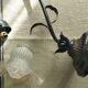 Tulip lamp in patinated black metal with an opaque glass shade.