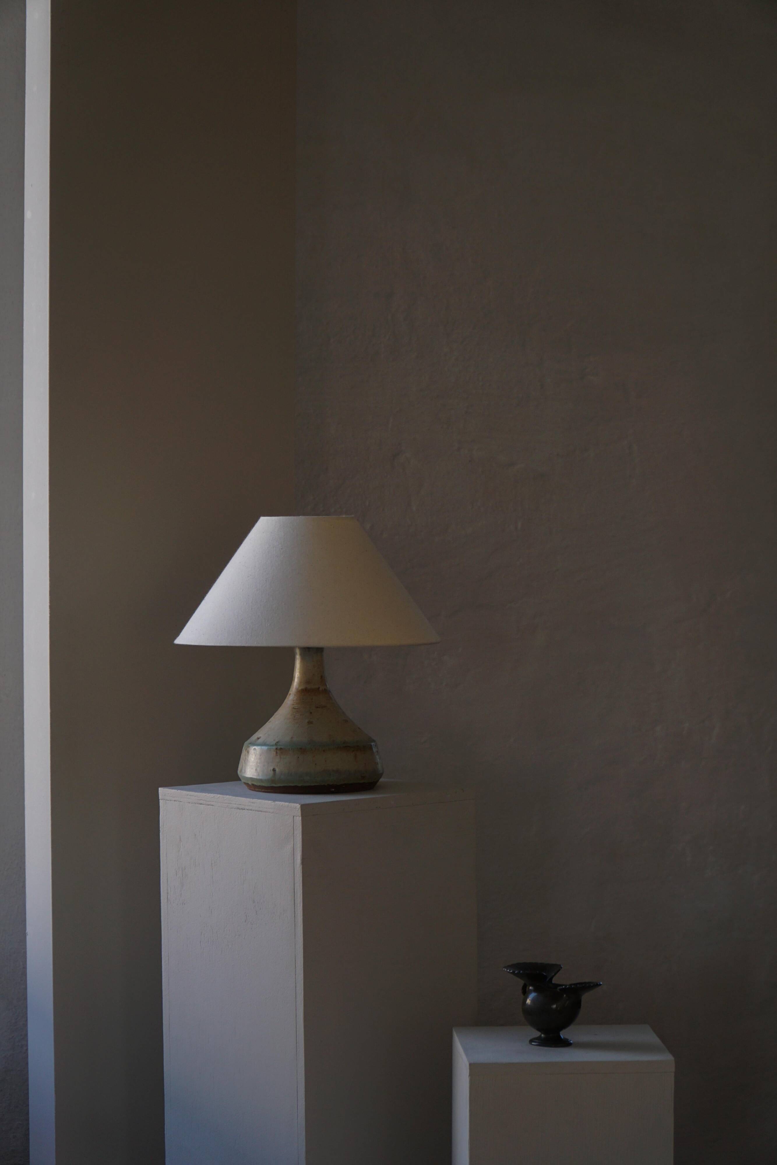 Modern Danish decorative table lamp in stoneware with flared base, Denmark, 1960s.