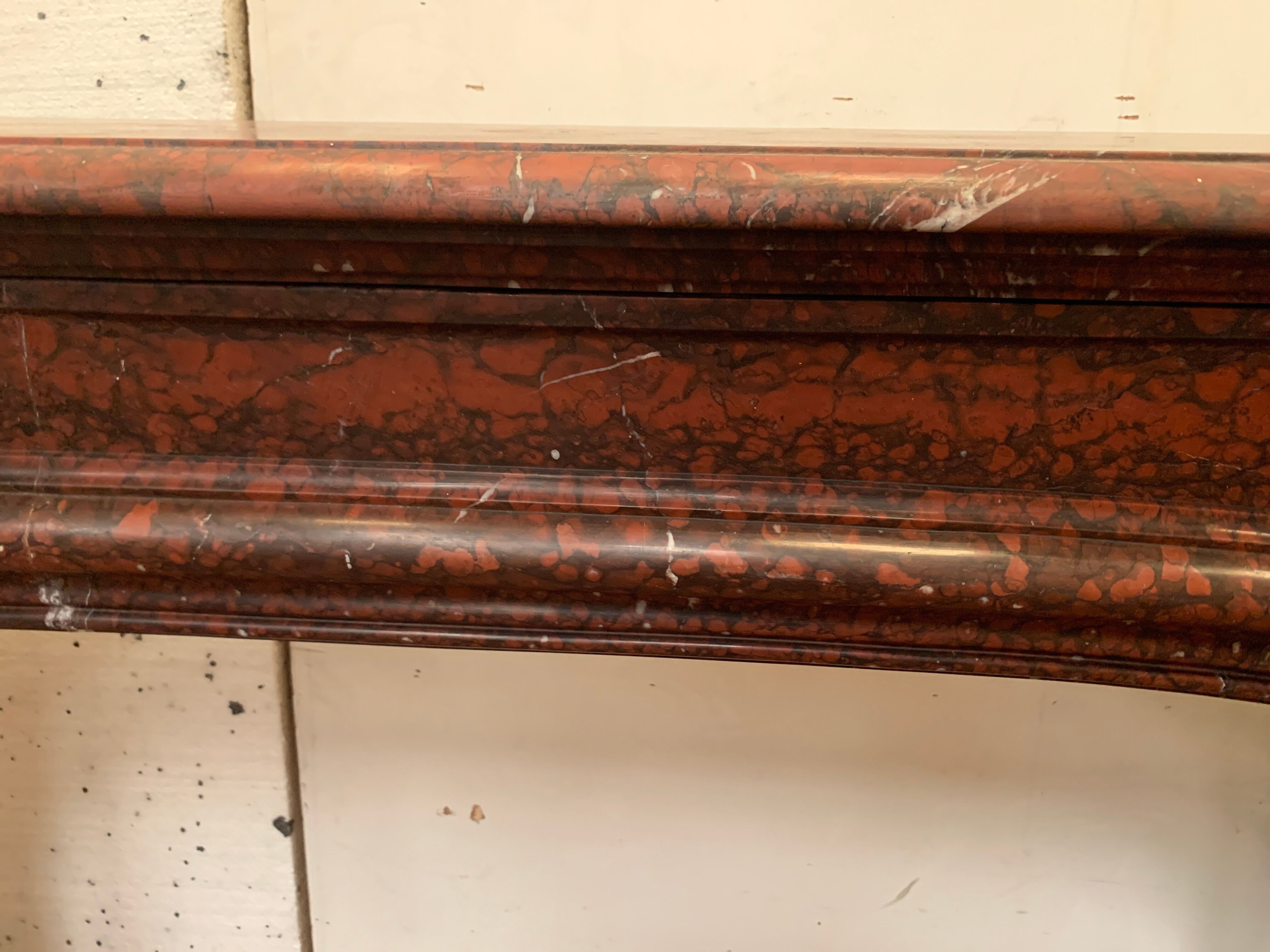 Pair of Louis XIV style fireplaces in red cherry marble. XIX century.