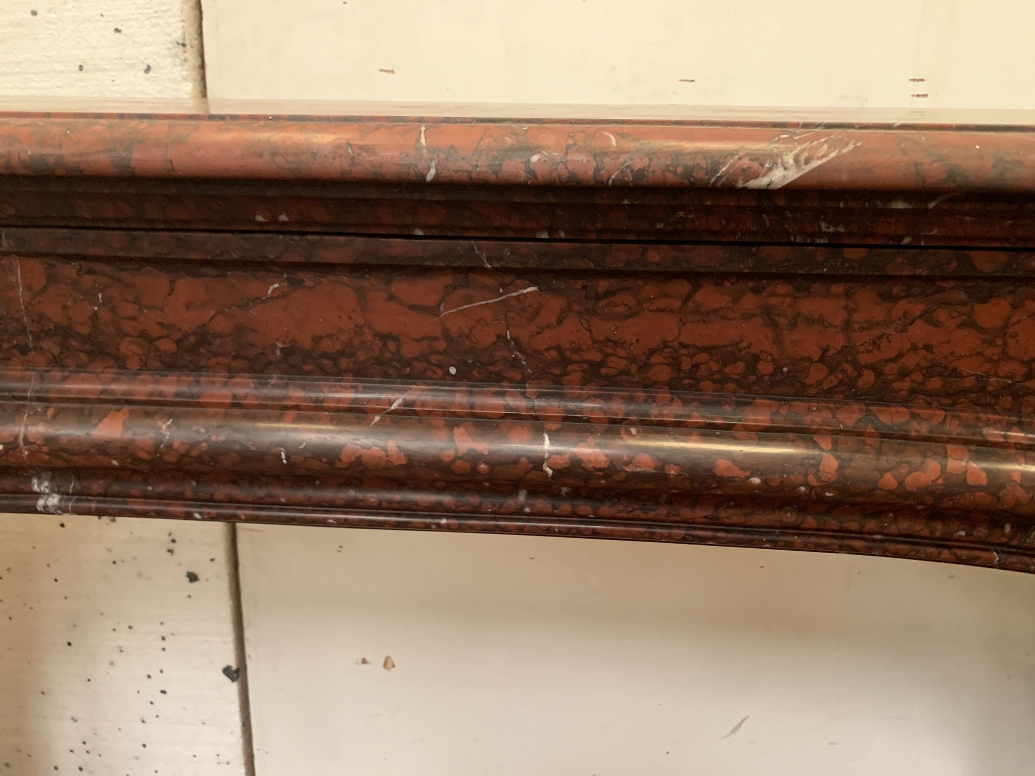 Pair of Louis XIV style fireplaces in red cherry marble. XIX century.
