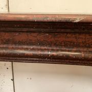 Pair of Louis XIV style fireplaces in red cherry marble. XIX century.