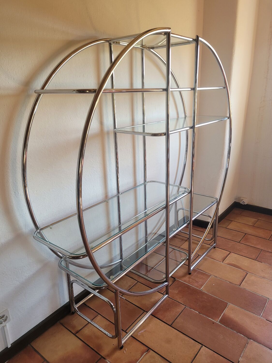 Bauhaus-style chrome round shelf