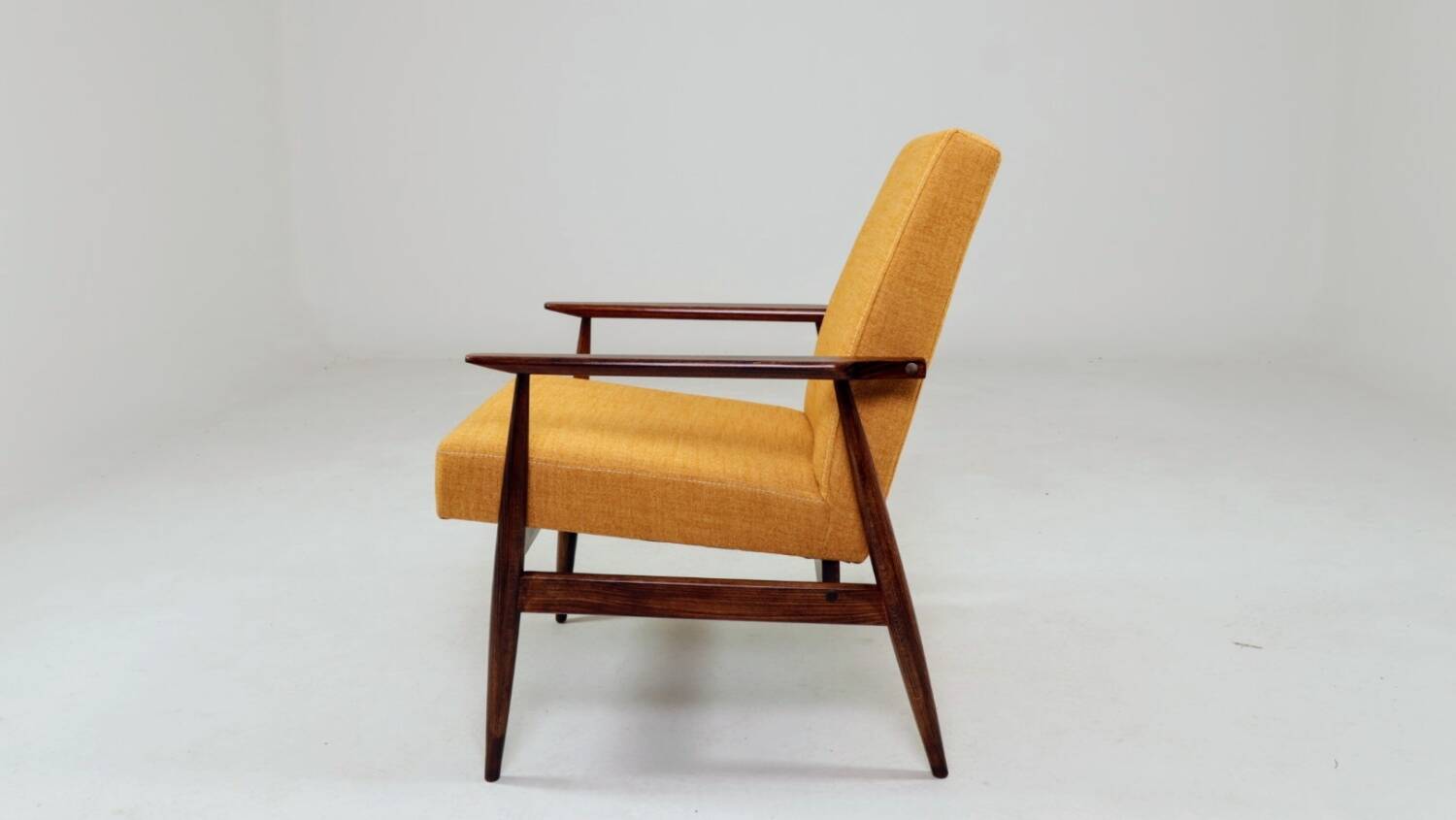 Vintage amber armchair Hermes designed by H. Lis