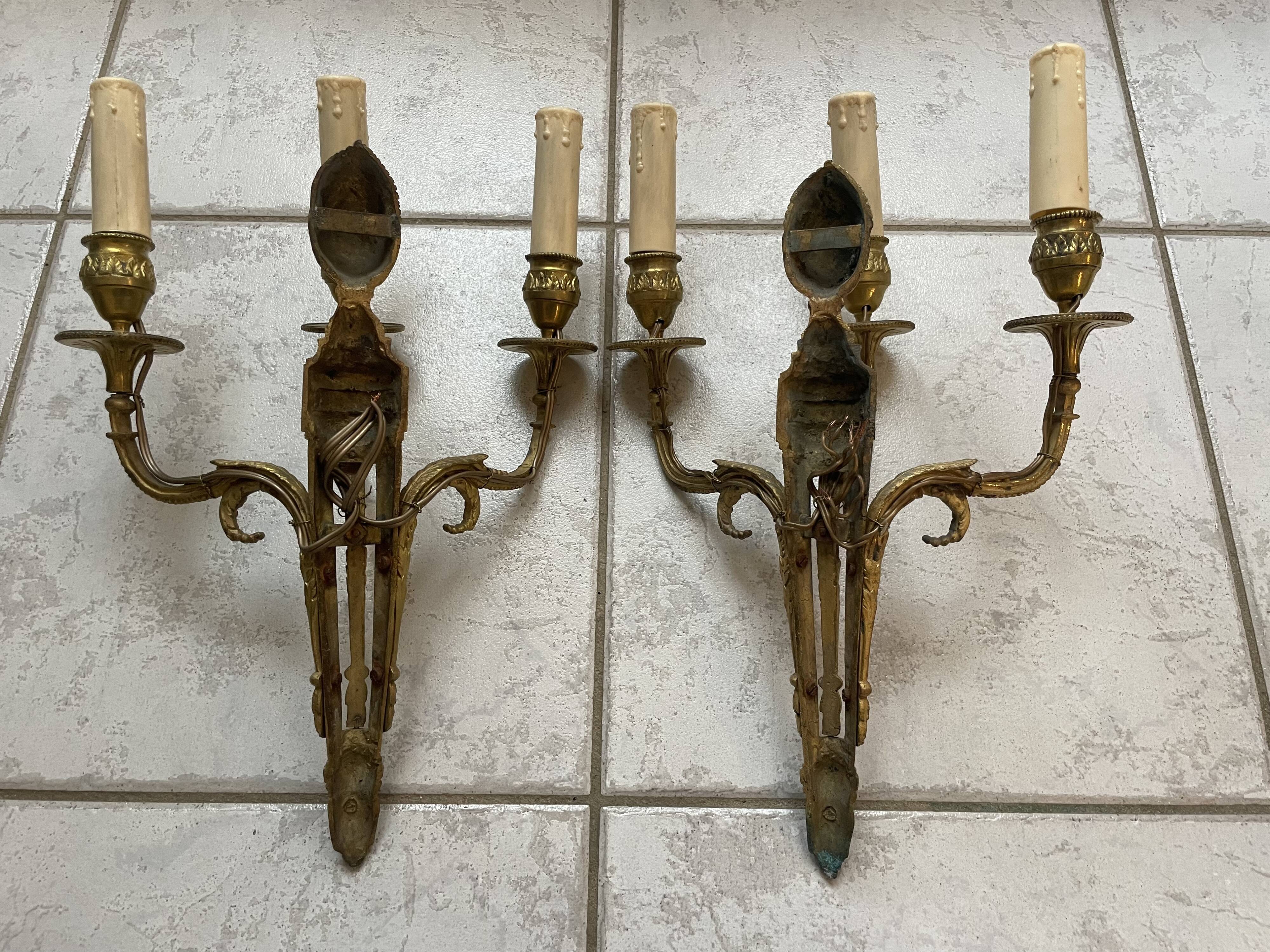 Pairs of Louis XVI bronze wall lamps