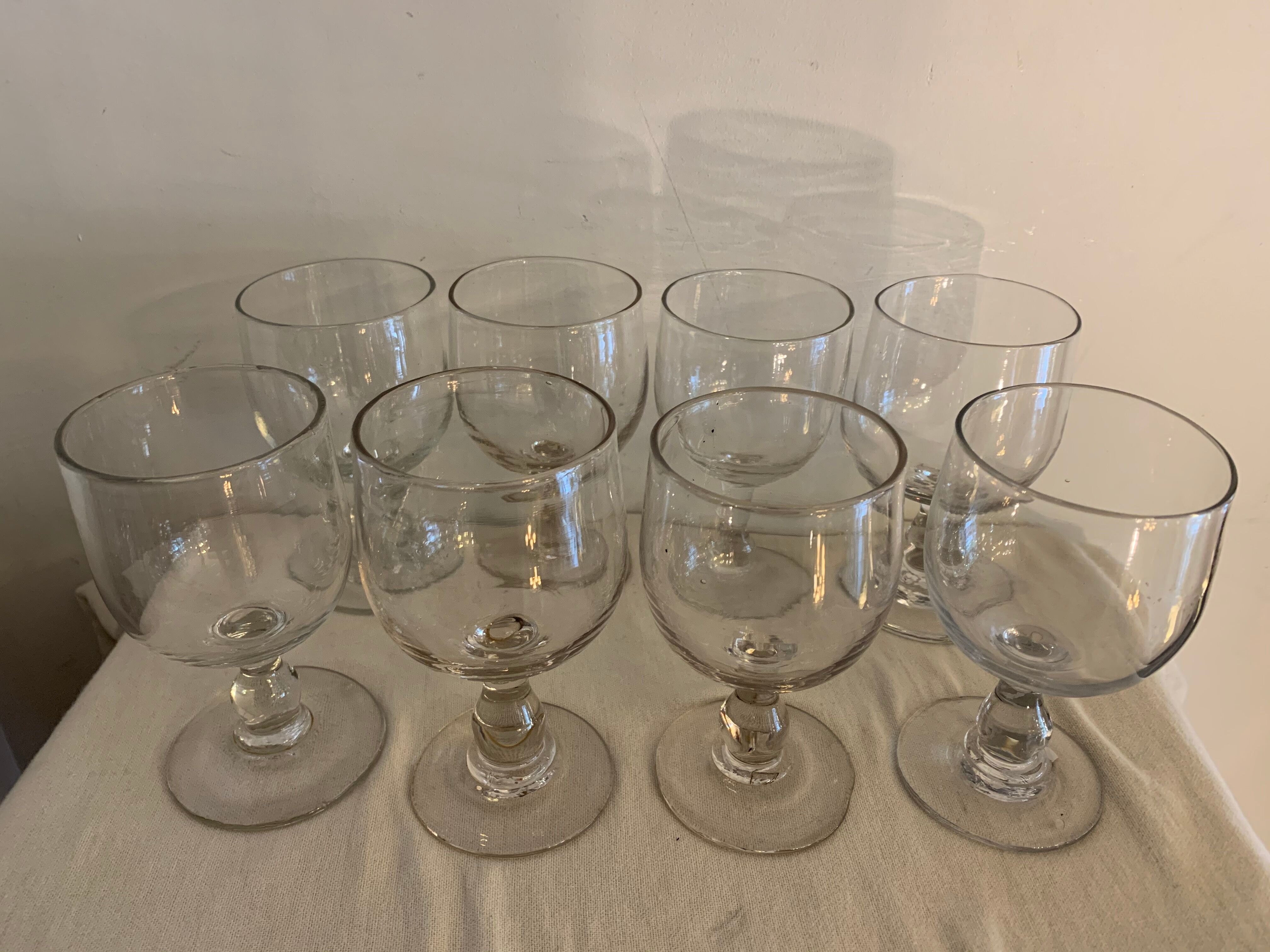 8 old red wine glasses with blown and bubbled glass walk