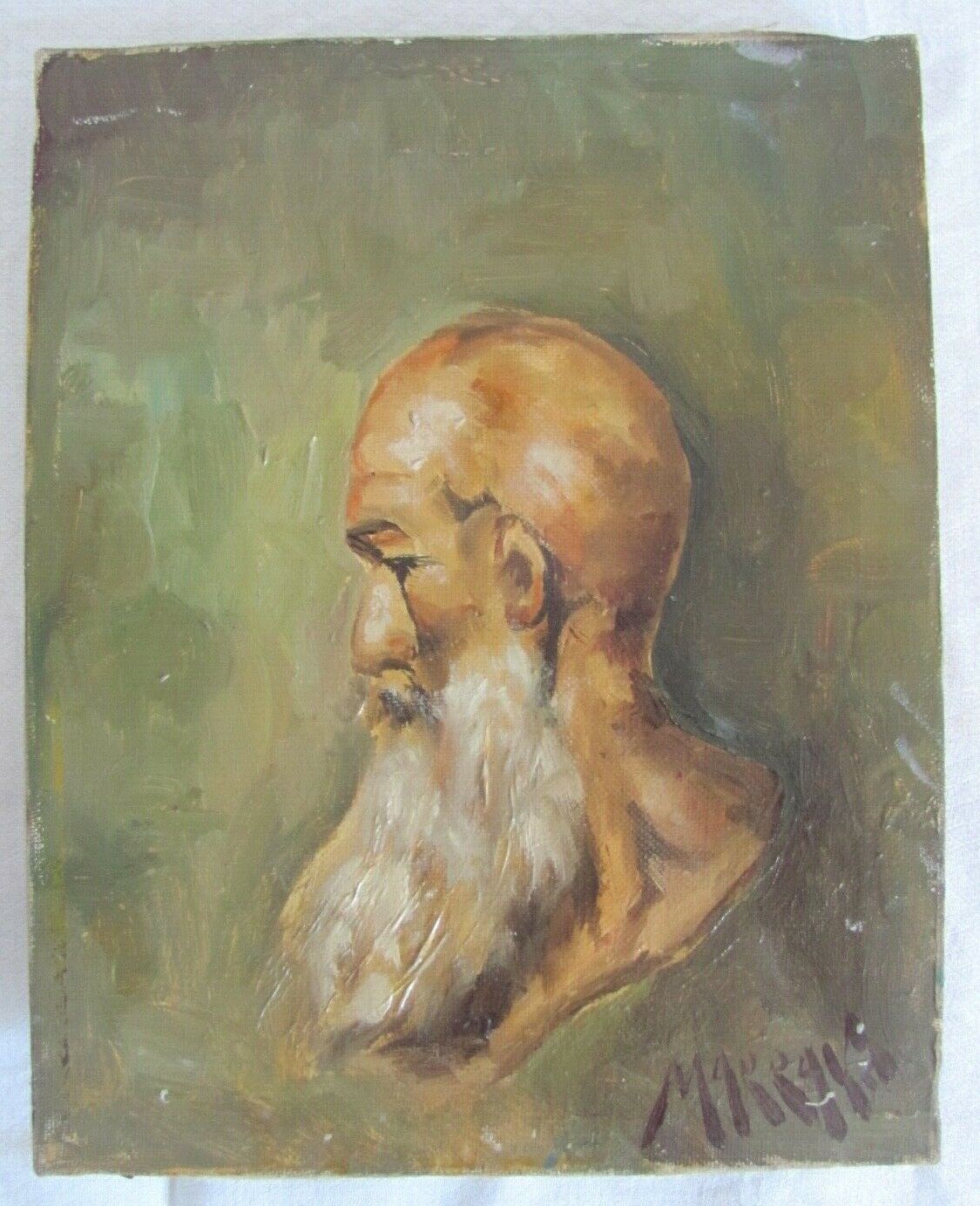 Portrait of a bald man with a long white beard