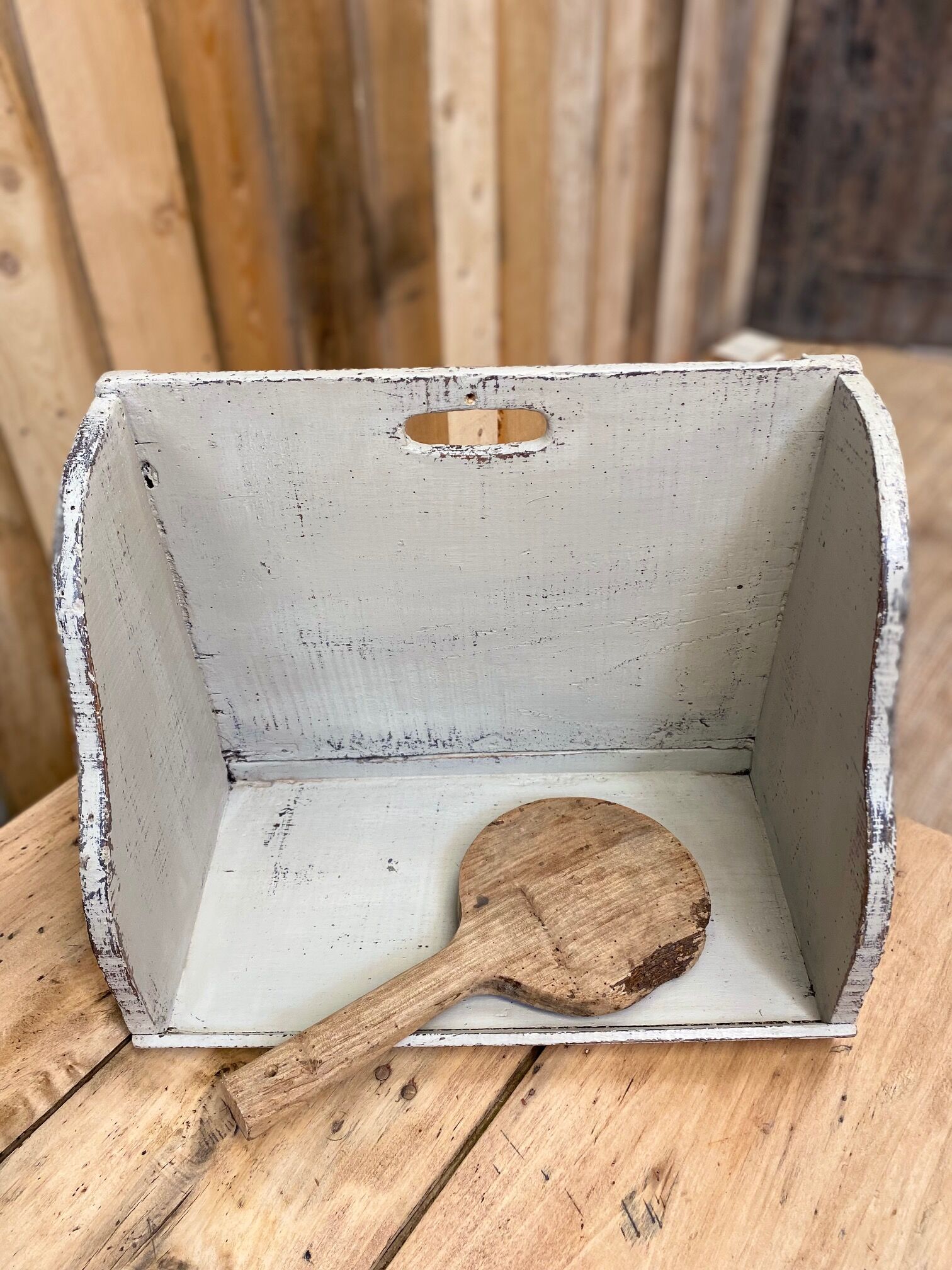 Old patinated washerwoman tray and its beater