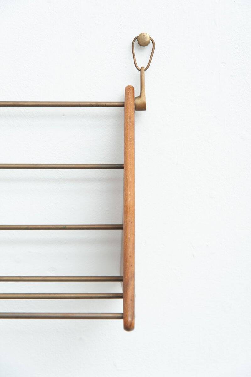 Wall-mounted walnut bookshelf by Carl Auböck, 1950s