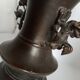 Chinese bronze vase with brown patina decorated with dragon and pho dog