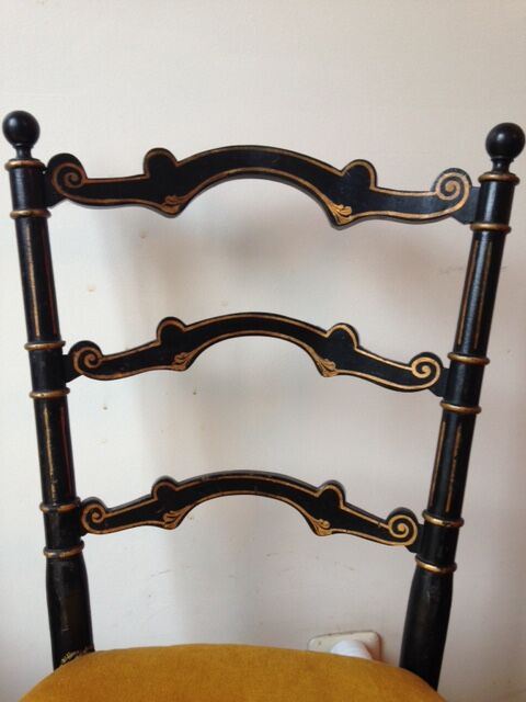 Pair of black and gold chairs