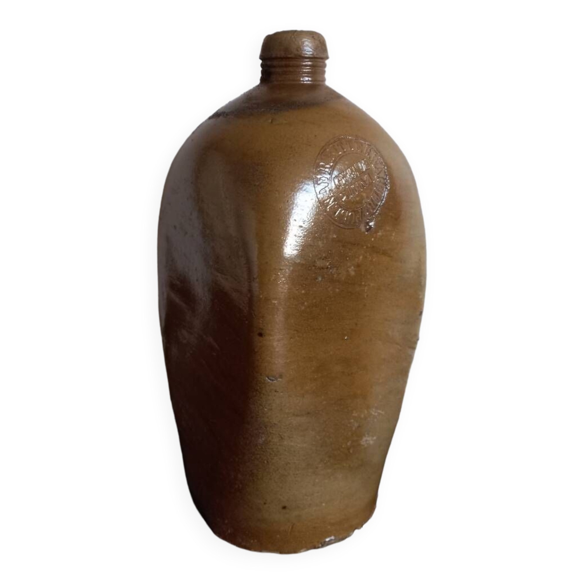 Old bottle of mineral water in salt stoneware
