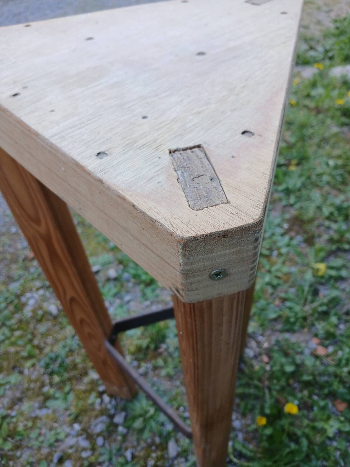 Antique saddle in raw wood and metal