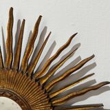 Sun Mirror called Witch's Mirror in gilded wood from the 20s