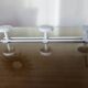 White lacquered metal wall coat rack with 3 hooks, 1980