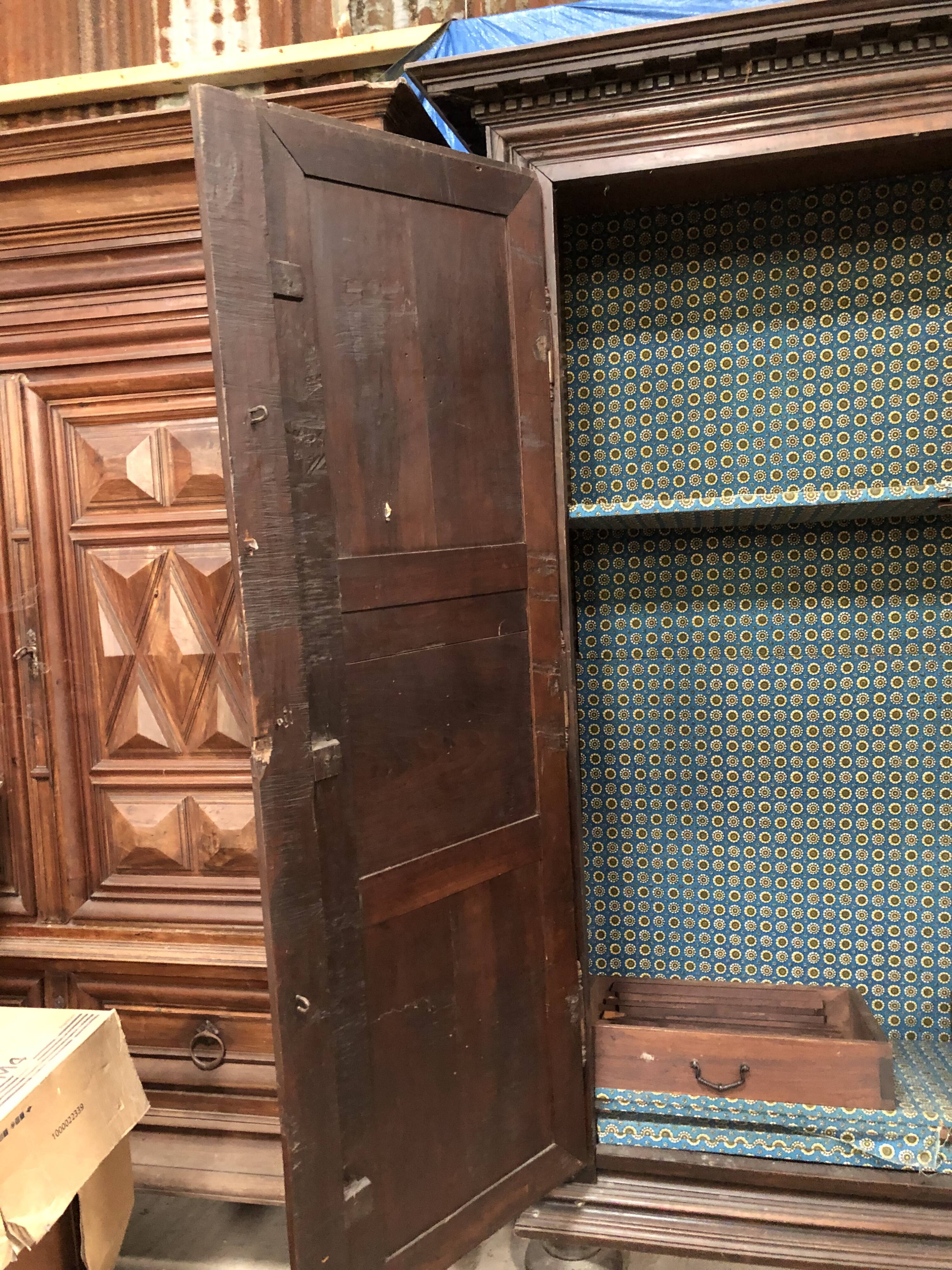 Antique Louis XIII armoire in solid walnut with carved doors