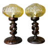 Pair African carved wood and amber glass table lamps