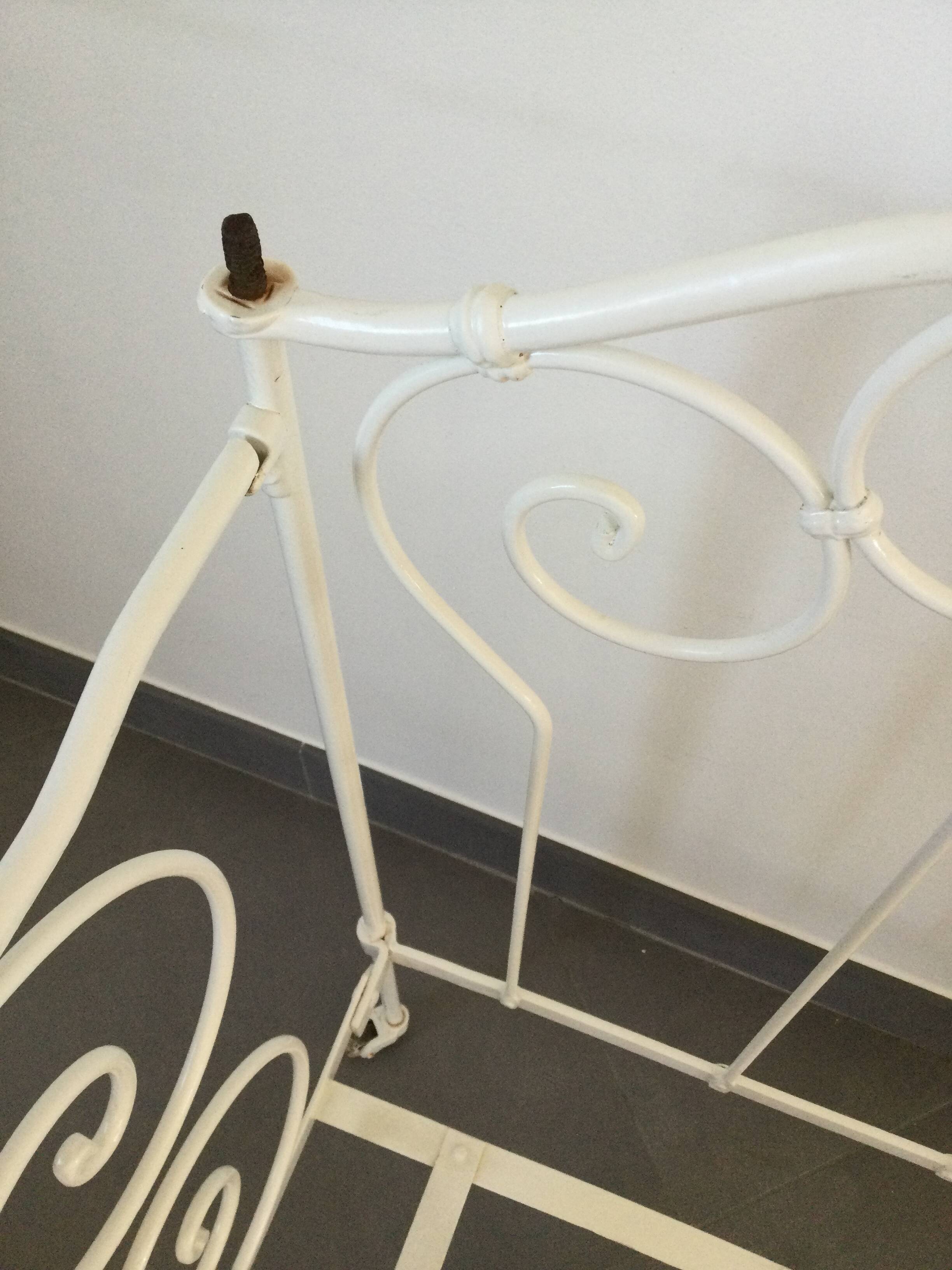 White wrought iron folding bed