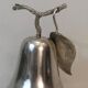 Silver-plated metal and plastic pear-shaped ice bucket.