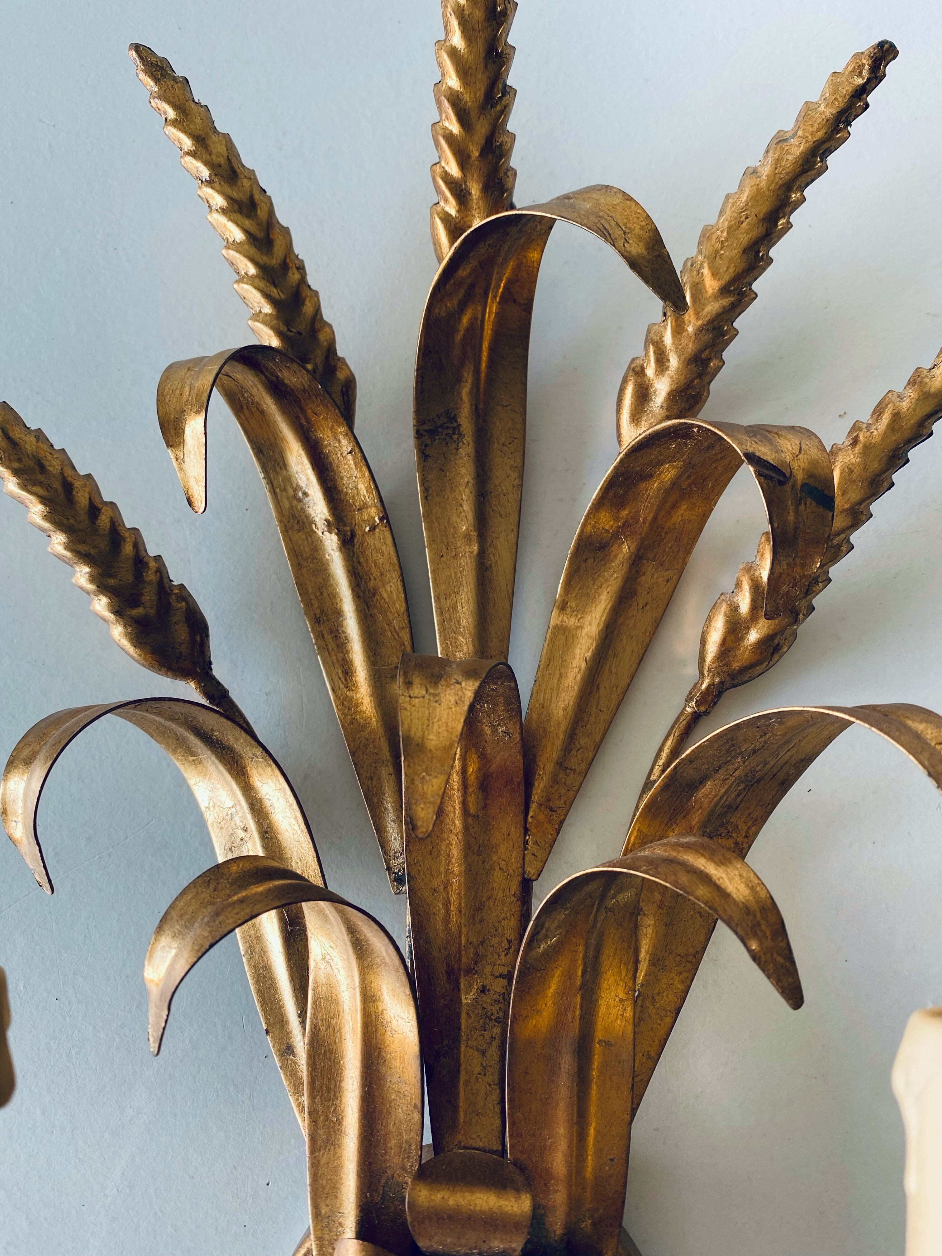 Double golden spike wall lamp