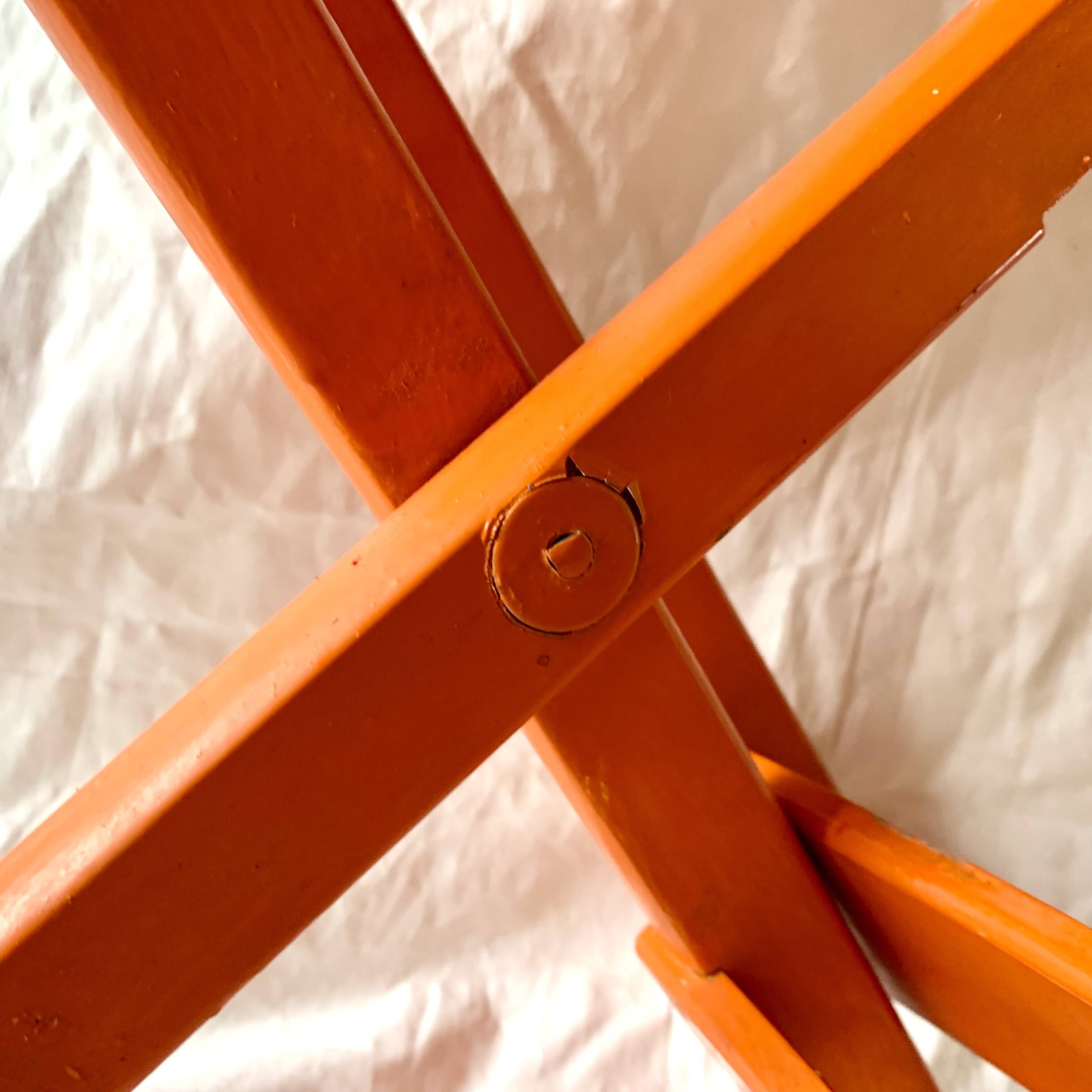 Vintage folding chair in orange painted wood
