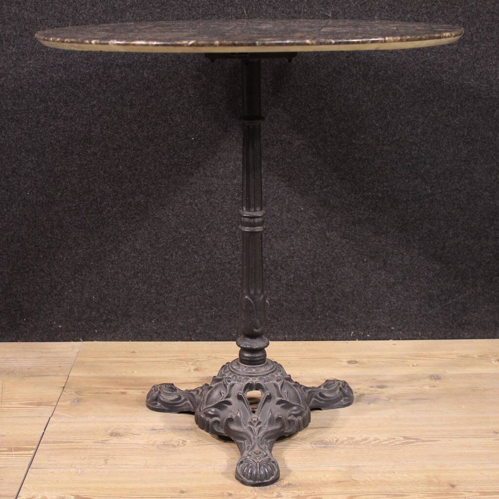 20th-century French iron bistro table with a marble top.