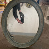 Patinated oval mirror