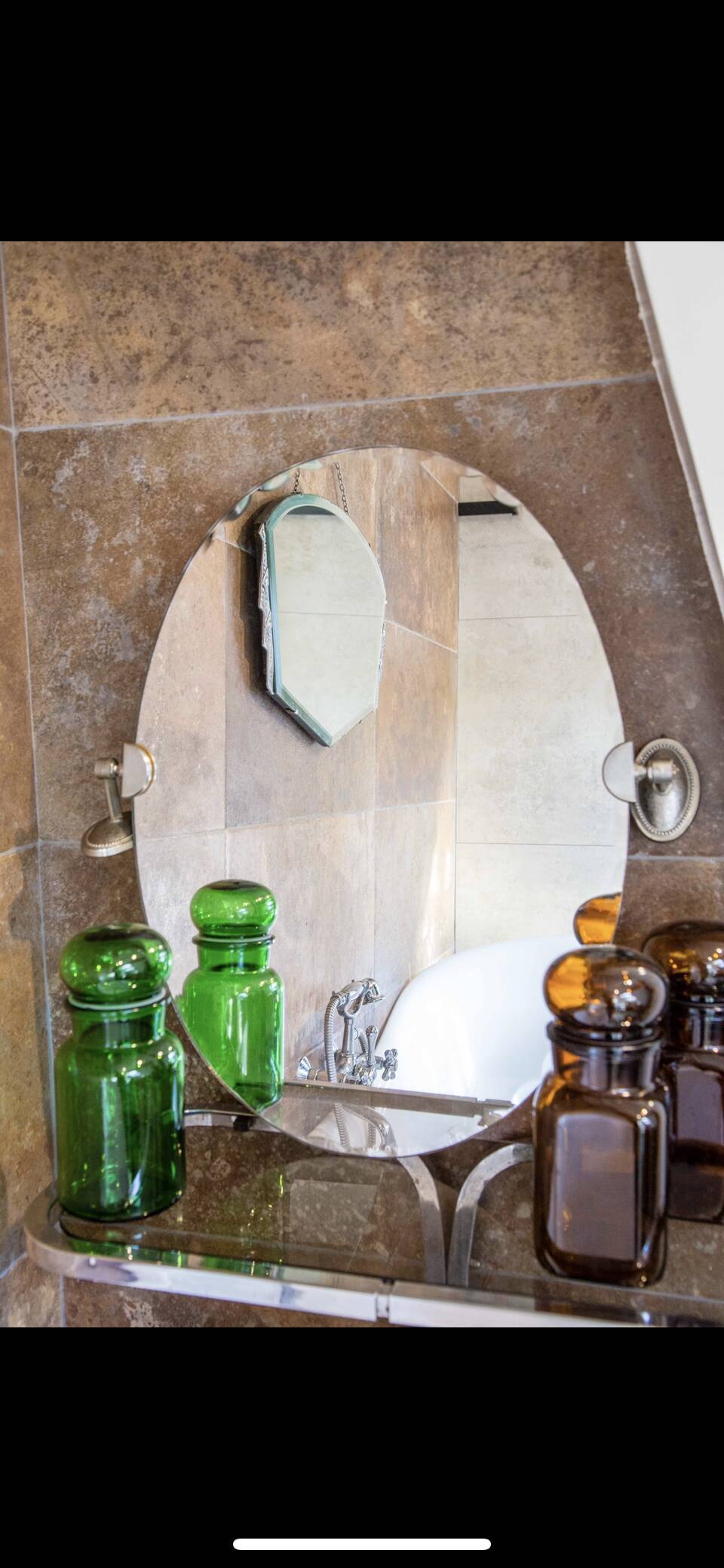 Adjustable oval beveled mirror