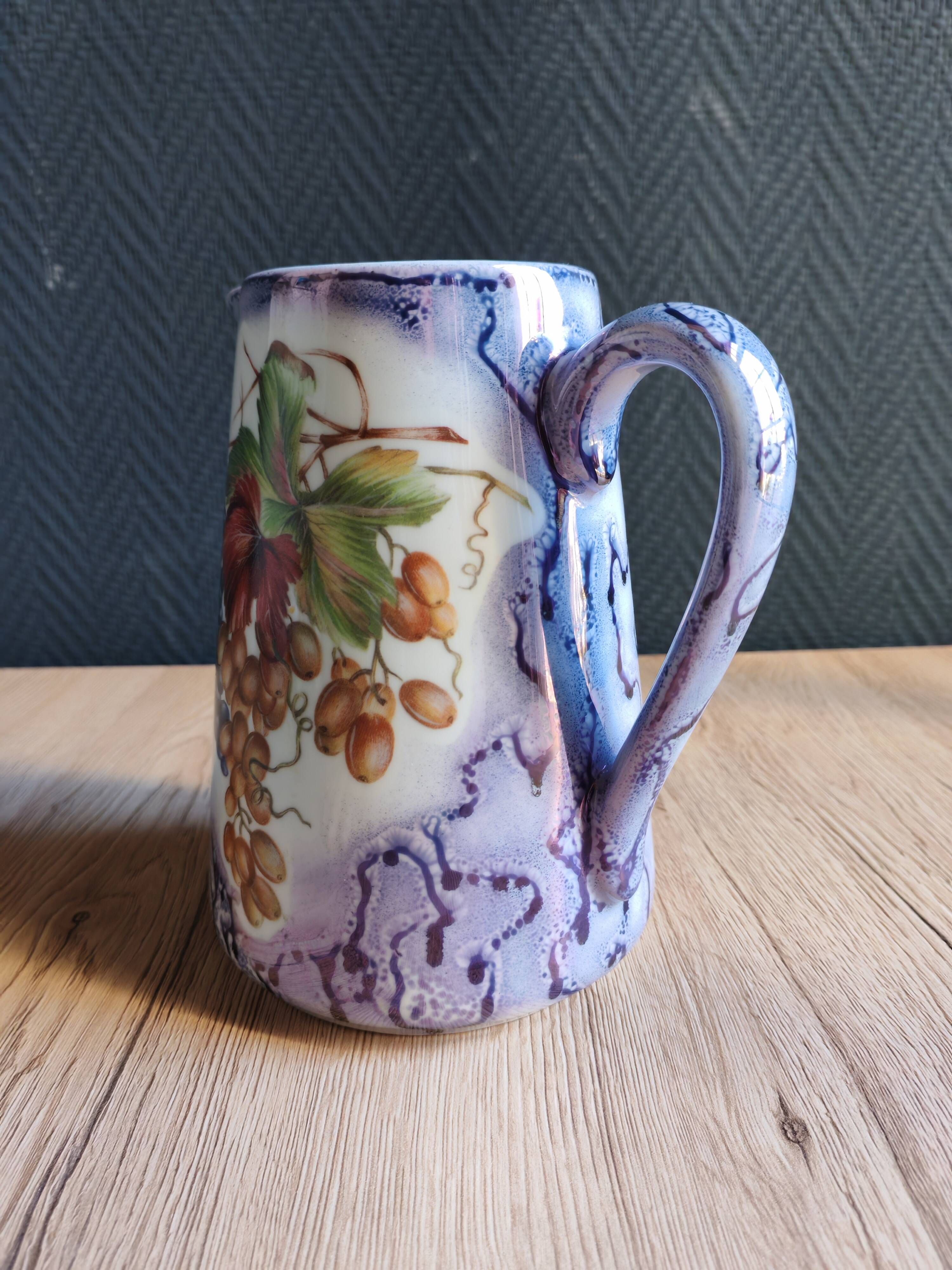 Vintage porcelain pitcher Lusseray France, decorated with grape clusters.